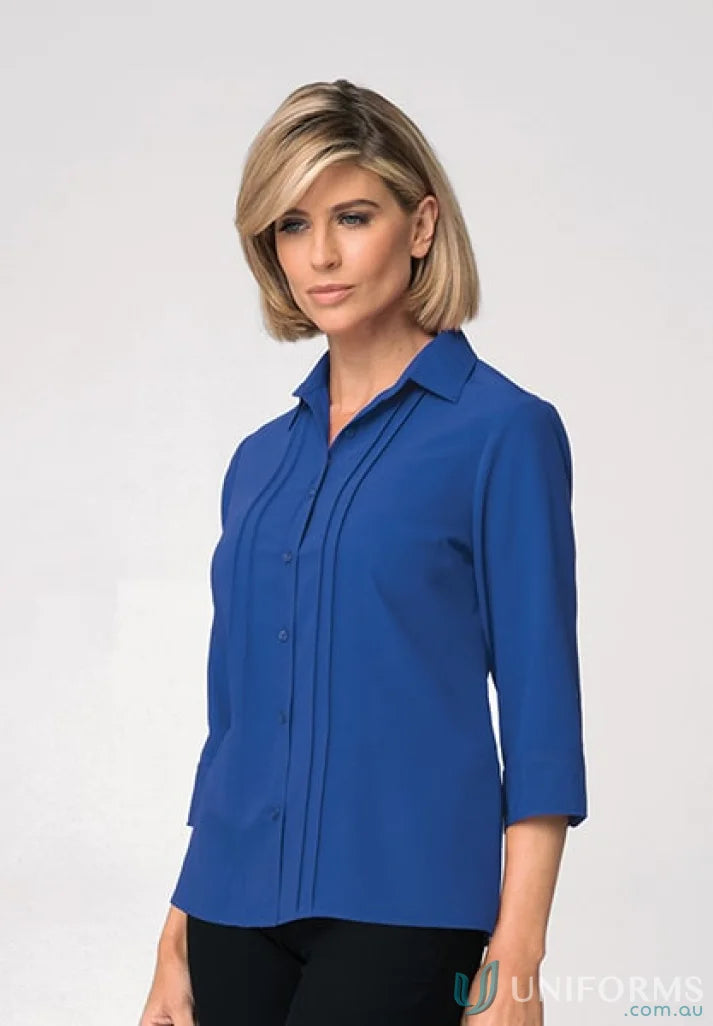Blue button-down blouse perfect for work with a comfortable fit and soft fabric