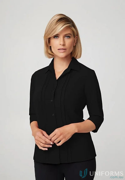 Woman in black button-down shirt showcasing perfect work fit and soft fabric of Sophia Top