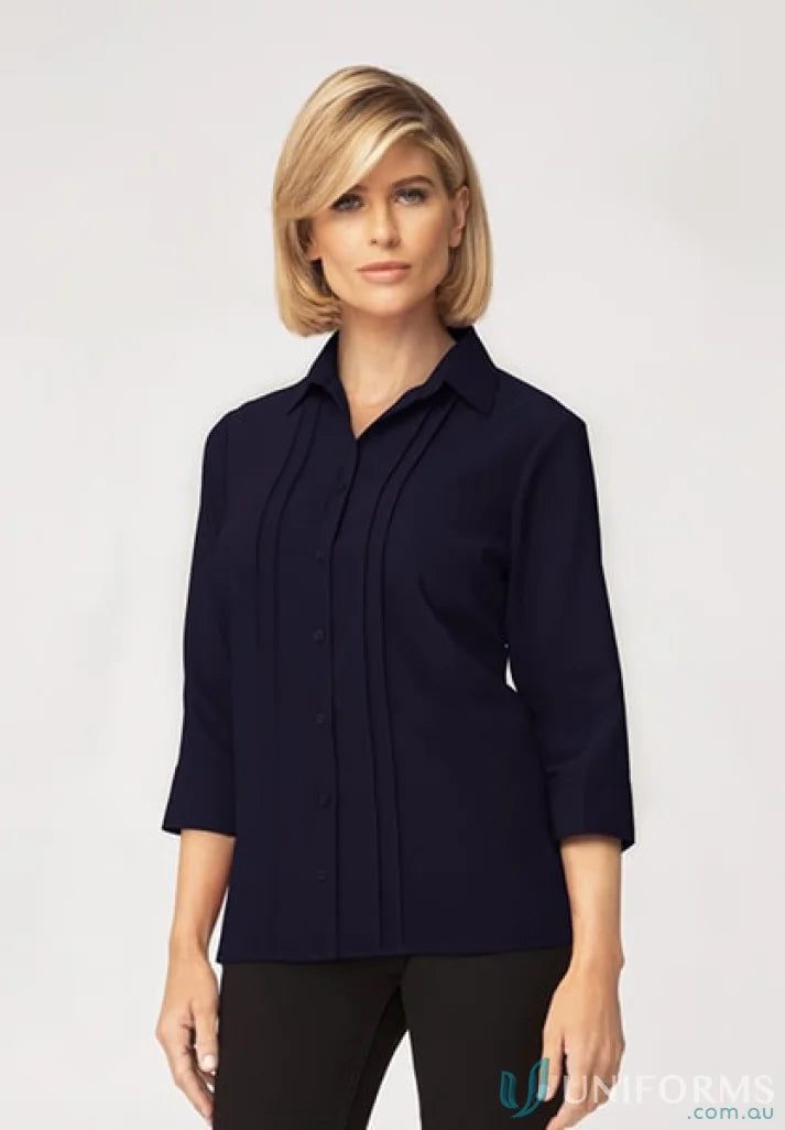 Woman in navy Sophia Top showing a perfect work fit and soft fabric feel