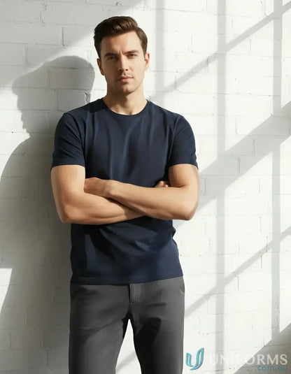 Man in navy Southport Tee from Biz Collection Men’s Ice with twin needle sleeve look
