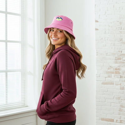 Sporties Twill Bucket Hat Youth in pink with cute penguin, maroon hoodie