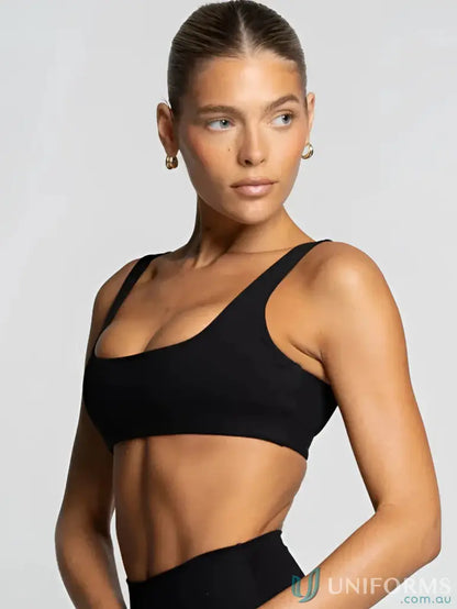 Black ribbed sports bra with square neck, perfect for stylish uniforms and workouts