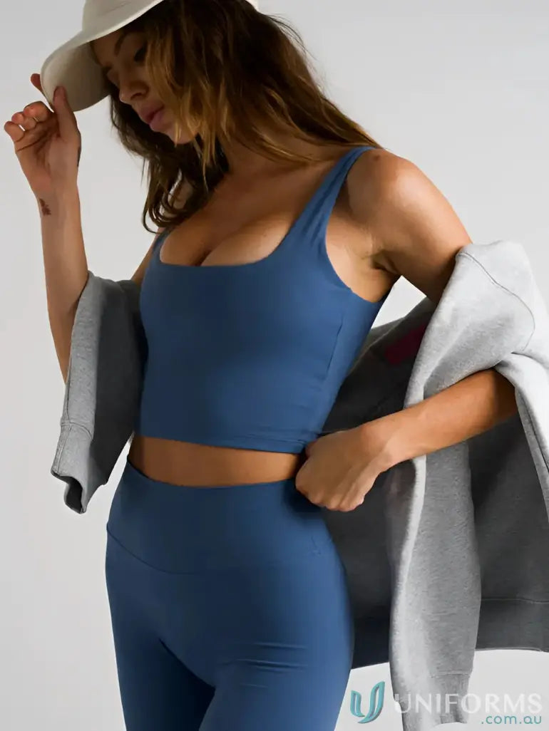 Blue athletic crop top and leggings with square neck tank style and shelf bra design