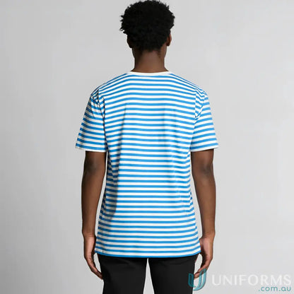 Man wearing staple stripe tee with blue and white stripes and black pants