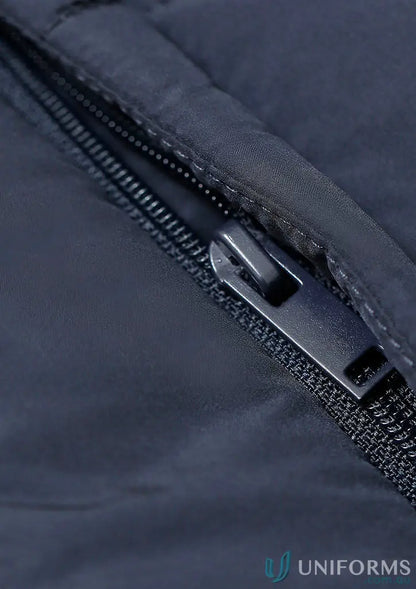 Dark blue sustainable insulated puffer vest with black zipper made from recycled PET bottles