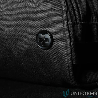 Black fabric with Swiss cross button on Swissdigital Arosa Wash Bag, great for work uniforms