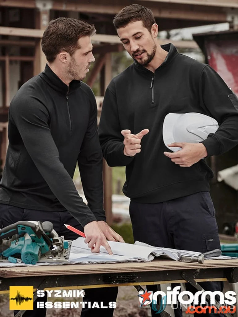 Two men wearing black zip brushed fleece Syzmic Half Zip Fleeces with zippered hip pockets
