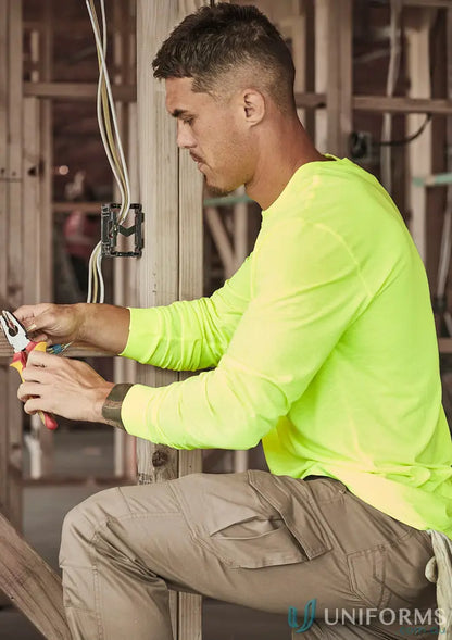 Man in Syzmic Hi Vis LS Tee working on electrical wiring, perfect vis long sleeve workwear