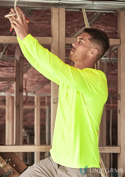 Man in neon yellow vis long sleeve tee working on electrical wiring, perfect everyday workwear