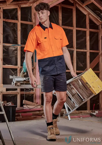 Construction worker in breathable cotton vis short sleeve workwear for staying cool on site