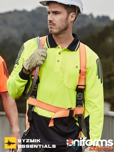 Construction worker wearing Syzmik men’s Flux Long Sleeve Sleeve Polo ZH310 with safety harness
