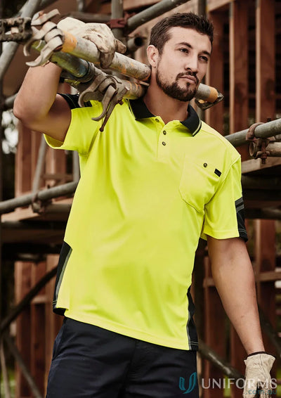 Man wearing Syzmik Men’s Sleeve Polo in vis reinforced squad short sleeve polo style