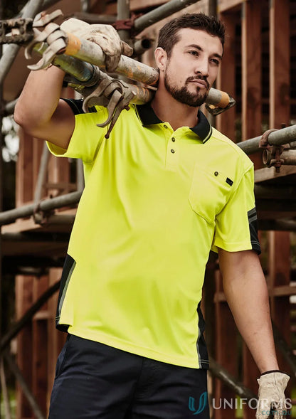 Man wearing Syzmik Men’s Sleeve Polo in vis reinforced squad short sleeve polo style