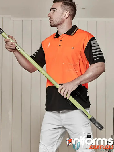 Man in Syzmic HiVis Zone SS Polo with reflective piping holding a pole