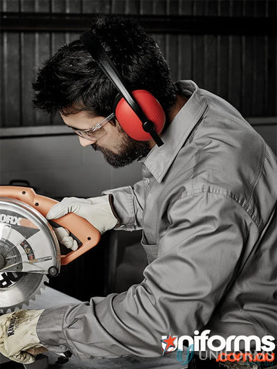 Man in Syzmic mens lightweight tradie long sleeve cotton twill shirt using circular saw safely