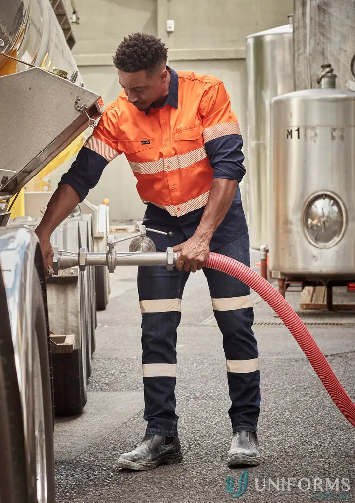 Man in high-vis segmented tape rugged workwear shirt connecting a hose in Syzmic Rugged Cooling HiVis Shirt