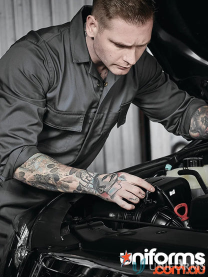 Gray mechanic jumpsuit from Syzmic Range Men’s with hip pockets and pen partition