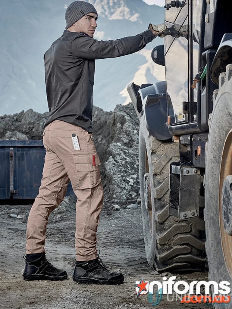 Man wearing Syzmik Streetworx men’s curved cargo pants for workwear style