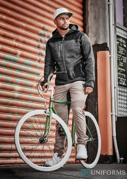 Man with bicycle wearing Syzmik Men’s Streetworx Stretch Pant with stretch pleating