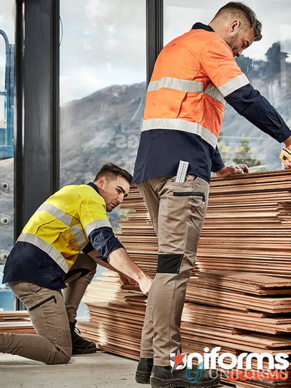 Two construction workers in high-vis Syzmik Men’s Streetworx stretch pants and modern slim fit
