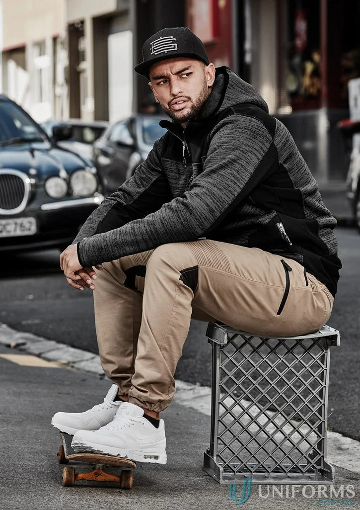Man in casual street style wearing Syzmik Men’s Streetworx Stretch Pant with stretch pleating