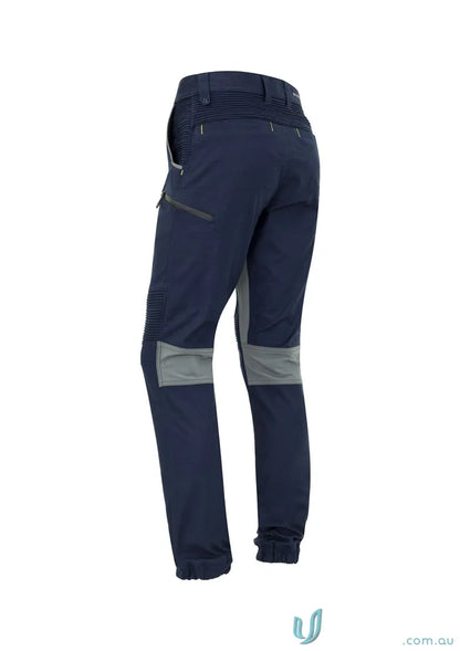 Navy blue Syzmic Men’s Streetworx Stretch Pant with gray knee patches and stretch pleating