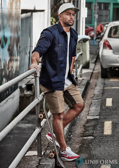 Man with skateboard wearing Syzmic Streetworx Stretch Shorts with four-way stretch crotch