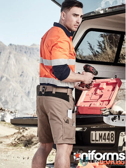 Construction worker using drill in Syzmik Men’s Streetworx Tough Shorts, tough shorts zs550