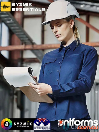Woman in blue Syzmik women’s lightweight tradie shirt with feminine fit and triple-stitched seams