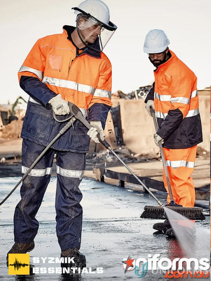 Workers in high-visibility clothing wearing Syzmik Day/Night Quilt Lined Storm Jacket