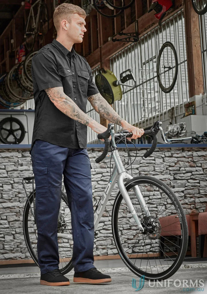 Man with bicycle in Syzmik Drill Cargo Pant, perfect for all-day comfort