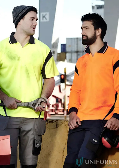 Two construction workers in safety attire wearing Syzmik Men’s Vis Aztec Aztec Short Sleeve Polo