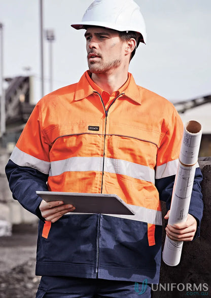 Construction worker in Syzmik HiVis Cotton Drill Jacket ZJ590 with flannel lining and safety gear