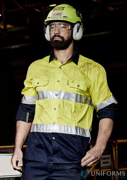 Man in safety gear wearing Syzmik Men’s Industrial Long Sleeve Shirt Hoop Taped zw123 for demanding work environments