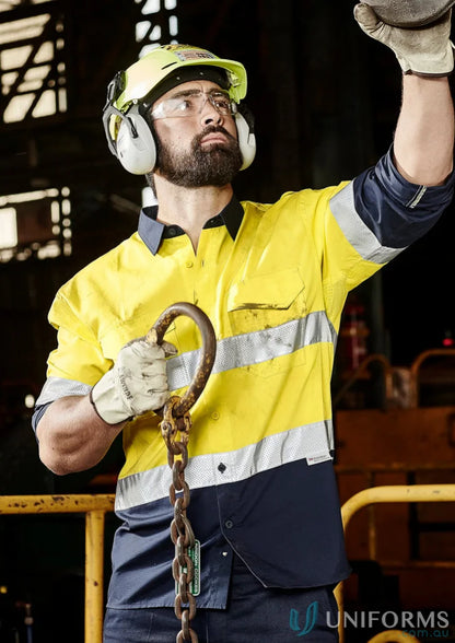 Man in safety gear holding chain wearing Syzmik Rugged Cooling Vis Taped Long Sleeve Shirt