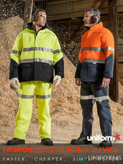 Two men in high-vis Syzmik Taped Storm Pant ZJ352 for demanding outdoor work