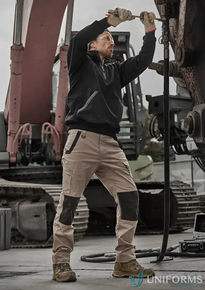 Man wearing Syzmik Unisex Streetworx Water Resistant 1/4 Zip Pullover in Black