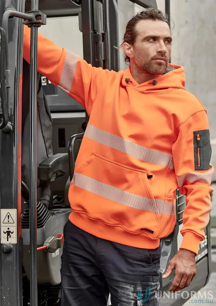 Man wearing Syzmik Unisex Streetworx Water Resistant Hoodie with segmented reflective tape