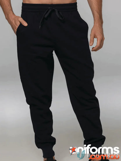 Black tapered fleece kids pants with drawstring, perfect for uniforms or workwear