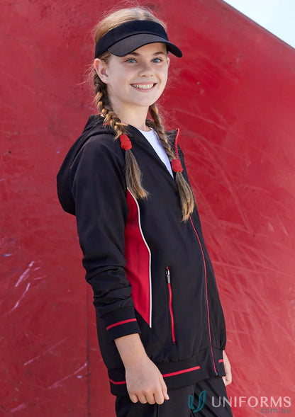 Girl in kids titan jacket j920k from Biz Collection Kids wearing a black and red hooded track jacket