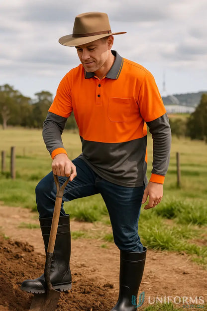 Man in workwear holding shovel wearing Traditional Gumboot BLACK, perfect for food grade uniforms