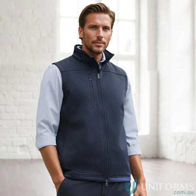 Man wearing navy U:Tech SoftShell Vest, a mens softshell vest to stay warm and look cool