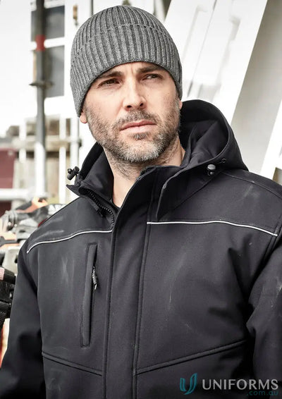 Man in black hooded unisex Antarctic Softshell Jacket and gray beanie for storm protection