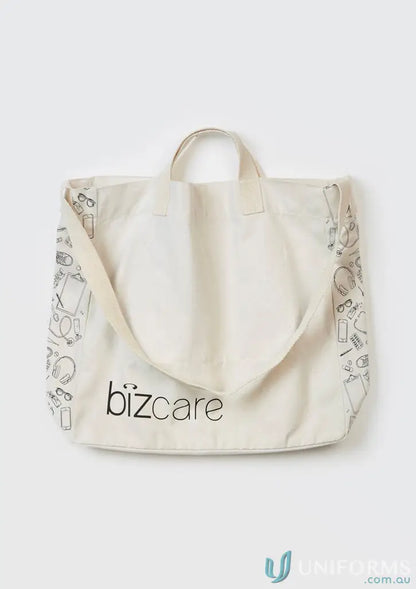 Cream-colored Unisex Biz Care Tote Bag with shoulder strap and black line art illustrations