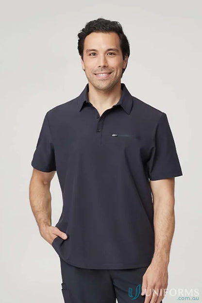 Man in dark navy city active stretch polo with zip chest pocket workwear uniform