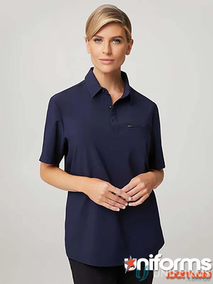 Woman modeling navy blue city active stretch polo shirt, perfect for workwear or uniforms