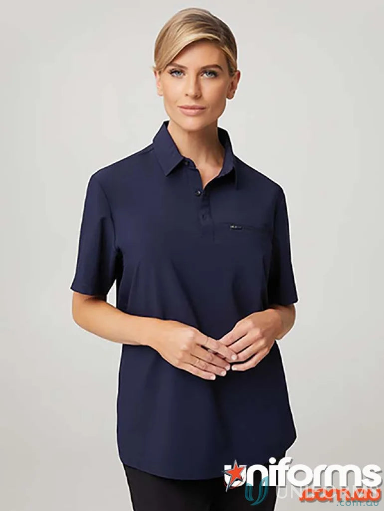 Woman modeling navy blue city active stretch polo shirt, perfect for workwear or uniforms
