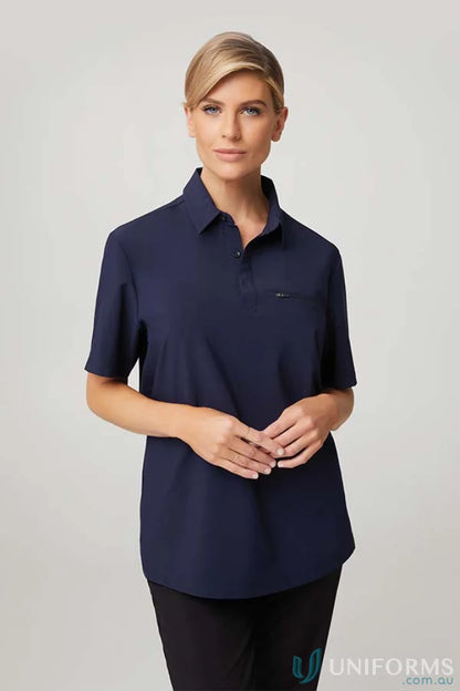 Woman in dark blue City Active Stretch Polo, perfect for workwear and uniforms