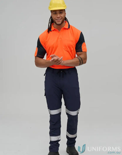 Man in workwear wearing Unisex DWR Water Repellent Flexi Work Pants with Tapes