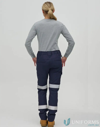 Woman wearing gray long-sleeve shirt and navy water repellent Flexi work pants